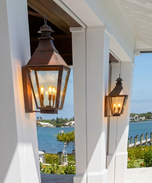 Outdoor entryway wall lights on a white wall 