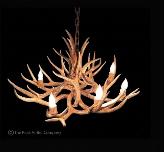 deer Antler chandelier with six lights on a black background, branded 'The Peak Antler Company'.