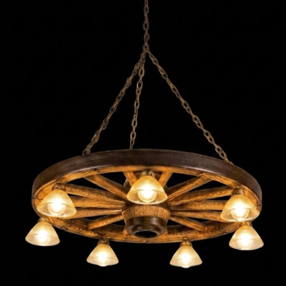 Rustic faux wagon wheel Chandelier made from an old wagon wheel with multiple light bulbs on a black background