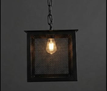 Black metal pendant light with a bulb on a dark background