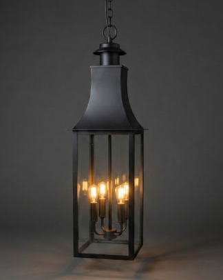 Black lantern-style pendant light with three visible bulbs on a dark background