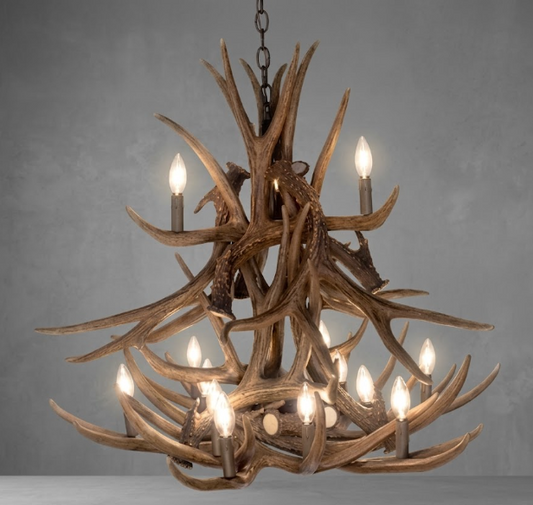 faux deerAntler chandelier with multiple lights on a gray background