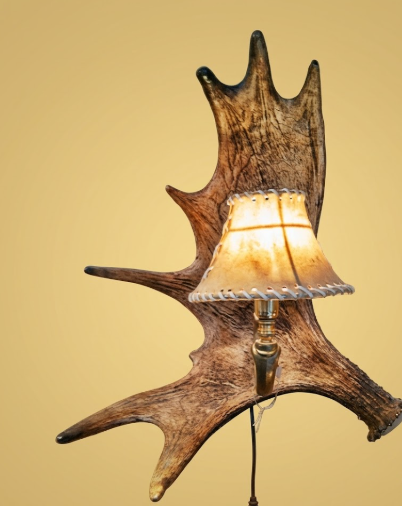 Wall-mounted lamp with antler design on a beige background