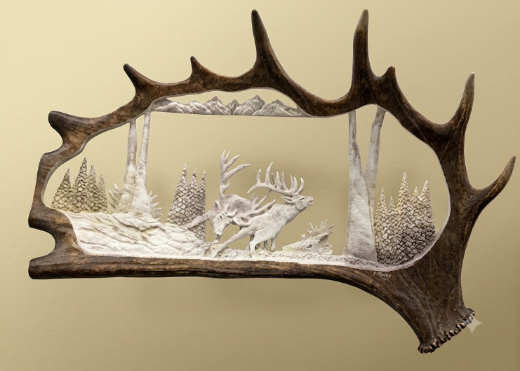 Decorative wall art with deer silhouette inside a deer antler frame on a beige background