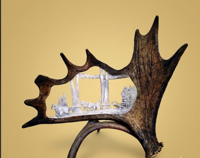 Decorative antler with a miniature scene inside on a beige background