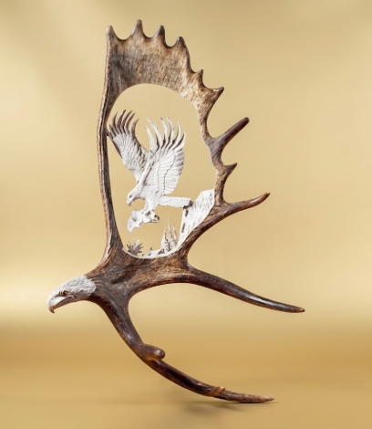 Moose antler carving  wall mount with an eagles head and eagle catching his dinner antler carving