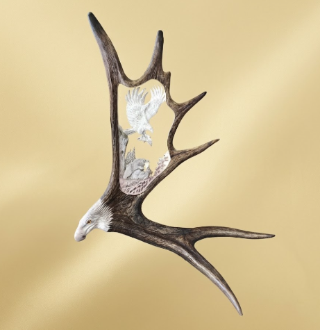 Decorative antler with an eagle emblem on a gold background
