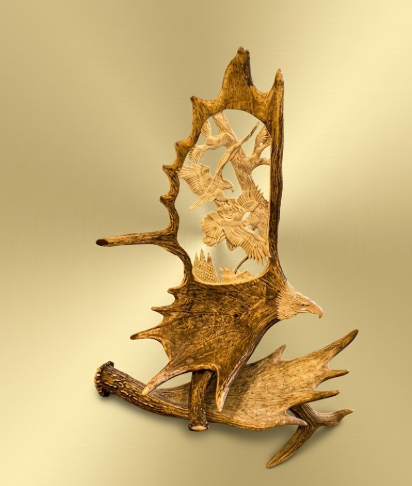 Moose antler carving of two eagles fighting
