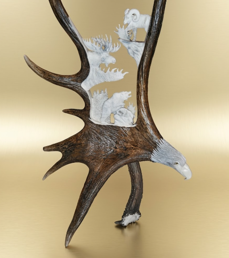 Decorative wall art with moose antlers  hand carving of the Idaho Big  on a beige background animals.