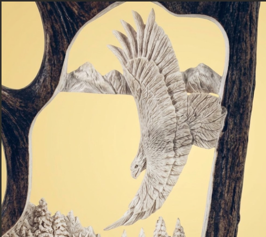 Decorative moose antler with an eagle flying between two trees on a beige background