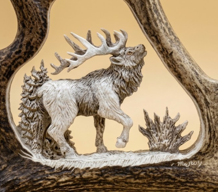 Majestic bull elk antler carving from a moose antler against a tan background.