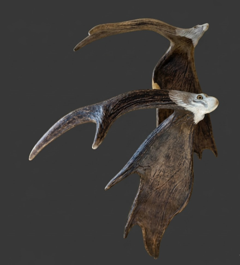 Moose antler eagle art on a dark background
