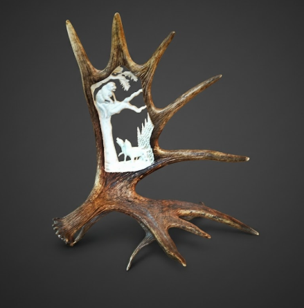 Table mount of a treed mountain lion and created out of a moose antler 