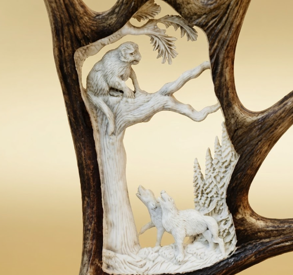 mountain lion moose antler carving of treed cougar