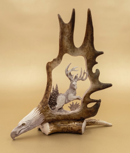 Jackalope caribou antler carving with a hand crafted eagle for the base, featured on a tan background.
