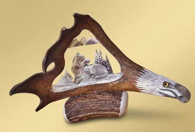 Desk mount caribou antler eagles head and napping wolf.