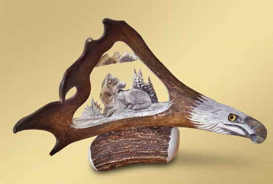 Desk mount caribou antler eagles head and napping wolf.