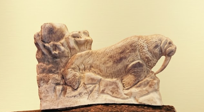 walrus antler carving with cream background 