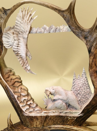 Hand carved decorative scene with a bear, eagle, mountains and trees framed by caribou antlers on a beige background