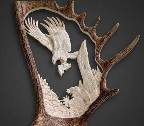 Decorative wall art with carved animals on a dark background