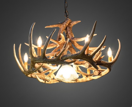 faux deer Antler chandelier with four lights on a dark background