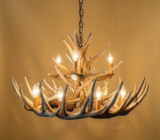 faux deer Antler chandelier with lights on a warm beige background