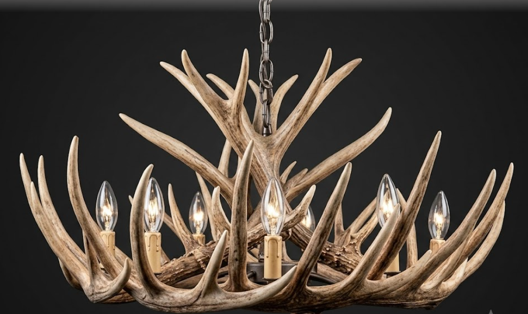 faux deer Antler chandelier with multiple light bulbs on a dark background