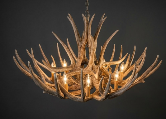 faux deer Antler chandelier with glowing lights on a dark background