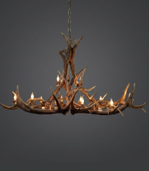 Oval Deer Antler chandelier on a dark gray background
