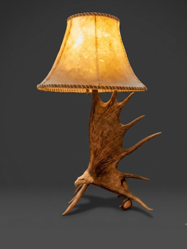Lamp with wooden antler base and brown lampshade on a dark background