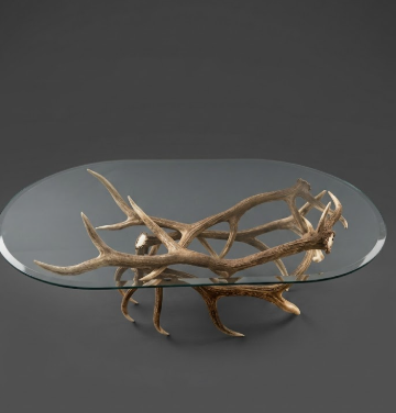 Real Elk Antler Glass coffee table with antler design on a dark background