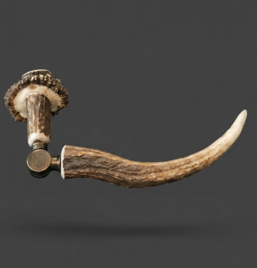 Decorative item with a curved antler design on a dark background