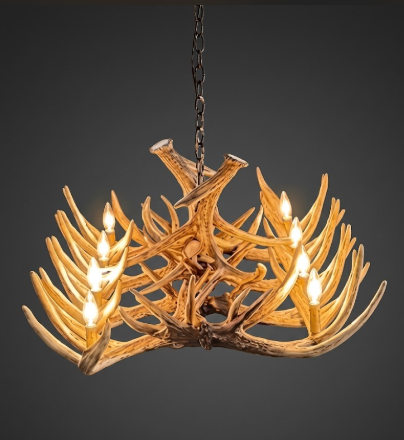 faux Antler chandelier with lights on a dark background