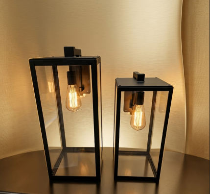 black modern copper glass foyer entryway lights lanterns sitting on the floor  