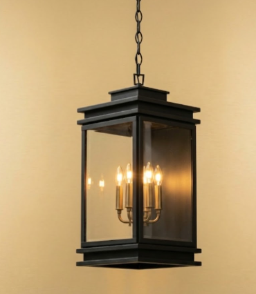 Black entryway pendant light with glass panels on a beige background