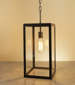 Decorative foyer entryway pendant light with a black metal frame on a beige background 