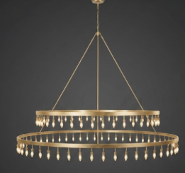 A Gold foyer entryway pendant light Chandelier with multiple light bulbs with multiple rings on a dark background
