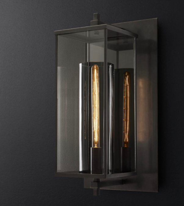 Modern black glass entryway outdoor wall light fixture with glass enclosure on a dark background