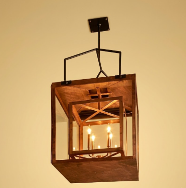 Decorative foyer entryway kitchen island pendant light with glass panels with a warm glow on a beige background
