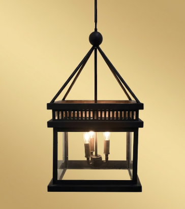 Hanging kitchen island pendant lights or chandeliers with glass panels on a beige background