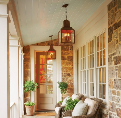 foyer kitchen island pendant light or chandeliers hanging in a patio area from a white ceiling with relaxing chairs on a front patio