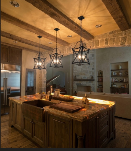 Modern kitchen with wooden island, granite countertops, and decorative foyer or entryway kitchen island pendant light or chandeliers 