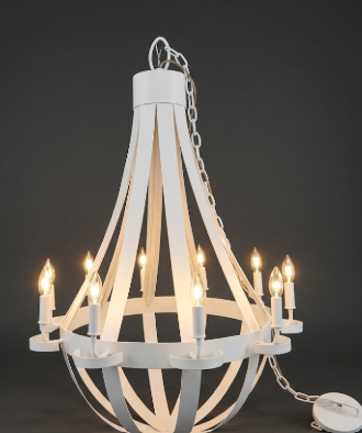 White copper foyer entryway kitchen island pendant light or chandelier with multiple lights on a dark background