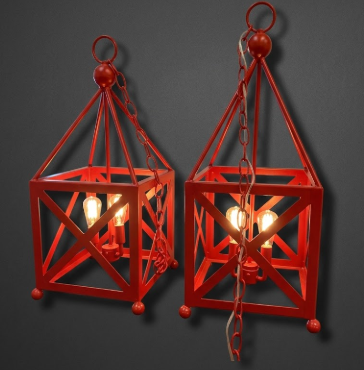 Two red metal foyer entryway kitchen island pendant lights or chandelier on a dark background