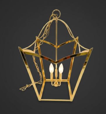 Gold pendant light fixture on a dark background