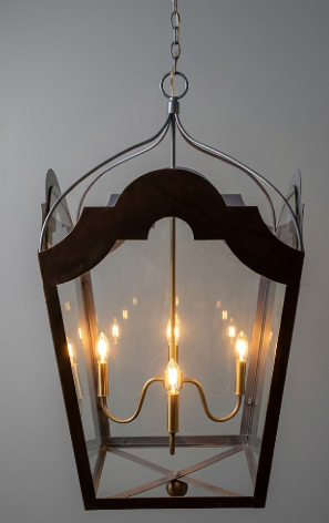 Decorative hanging pendant light or lantern with glass panels on a plain background
