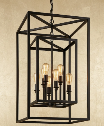 Black metal pendant light fixture with multiple bulbs on a beige background