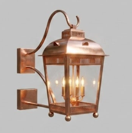Vintage-style wall-mounted  raw copper entryway light  lantern with glass cover on a dark background