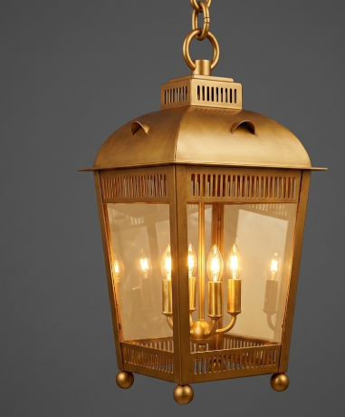 Decorative hanging pendant light lantern with glass panels on a gray background